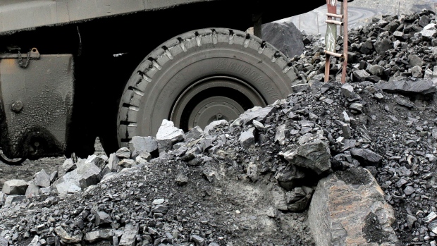 A truck carries excavated iron ore from the open pit of the Lebedinsky GOK (LGOK) iron ore mining and processing plant, operated by Metalloinvest Holding Co., in Gubkin, Russia, July 13, 2017. The new hot briquetted iron (HBI) production line at the Lebedinsky mine in Russia has an output capacity of 1.8m tons per year, a spokeswoman said by phone. 