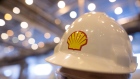 The Shell logo sits on a protective hard hat at the Royal Dutch Shell Plc lubricants blending plant in Torzhok, Russia, on Wednesday, Feb. 7, 2018. The oil-price rally worked both ways for Royal Dutch Shell Plc as improved exploration and production lifted profit to a three-year high while refining and trading fell short of expectations as margins shrank. 