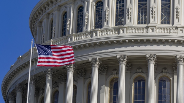 An American flag flies on the U.S. Capitol Building during a partial government shutdown in Washington, D.C., U.S., on Sunday, Jan. 20, 2019. President Donald Trump made his first substantive offer of the government shutdown aimed at peeling off moderate Democrats and shifting blame with an American public that so far overwhelmingly holds him responsible for the month-long impasse. 