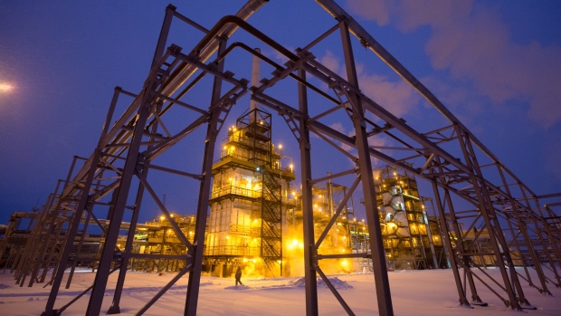 Lights illuminate the low-temperature isomerization unit at the Novokuibyshevsk oil refinery plant, operated by Rosneft PJSC, in Novokuibyshevsk, Samara region, Russia, on Wednesday, Dec. 21, 2016. Oil trimmed a second weekly gain as investors weighed rising U.S. inventories against coming coordinated output cuts by OPEC and other producing nations. 