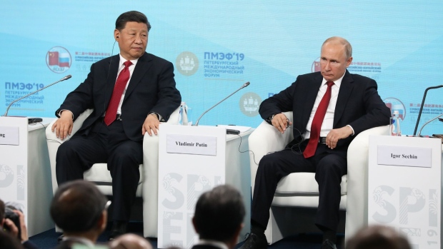 Xi Jinping and Vladimir Putin on June 7.  Photographer: Andrey Rudakov/Bloomberg