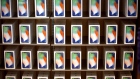 Apple Inc. iPhone X smartphones are displayed during the sales launch at a store in New York, U.S., on Friday, Nov. 3, 2017. The $1,000 price tag on Apple Inc.'s new iPhone X didn't deter throngs of enthusiasts around the world who waited -- sometimes overnight -- in long lines with no guarantee they would walk out of the store with one of the coveted devices. 
