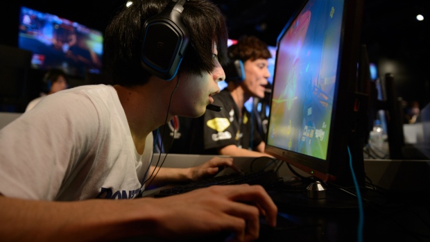 Attendees play Activision Blizzard Inc.'s Overwatch computer game at the AOC Open e-Sports event in Tokyo. 