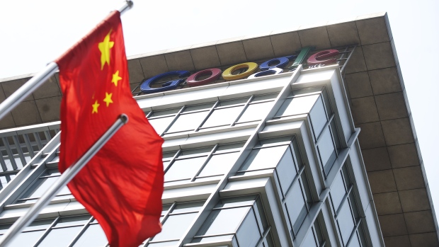 A Chinese flag blows in the wind in front of Google Inc.'s offices in Beijing, China, on Thursday, June 2, 2011. Google Inc., owner of the world's most popular search engine, said hackers tried to steal passwords from hundreds of Gmail users, targeting the accounts of government officials in the U.S. and Asia. 