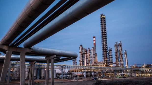 Oil cracking towers stand in the Duna oil refinery, operated by MOL Hungarian Oil & Gas Plc, in Szazhalombatta, Hungary, on Monday, Feb. 13, 2019. Oil traded near a three-month high as output curbs by OPEC tightened global supply while trade talks between the U.S. and China lifted financial markets. 