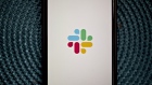 The Slack Technologies Inc. logo is displayed on an Apple Inc. iPhone in an arranged photograph taken in Arlington, Virginia, U.S. on Monday, April 29, 2019. Slack's filing last week confirms its plans to avoid a traditional public offering and instead list its shares directly on the New York Stock Exchange under the symbol SK. 