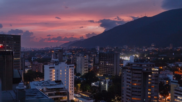 The sun sets over Caracas on May 13, 2019. Photographer: Adriana Loureiro Fernandez/Bloomberg