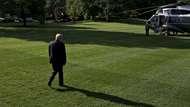 U.S. President Donald Trump walks on the South Lawn of the White House before boarding Marine One in Washington, D.C. 