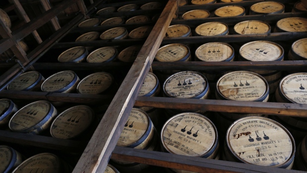 Barrels of bourbon whiskey sit stacked in an aging warehouse at the Brown-Forman Corp. Woodford Reserve distillery in Versailles, Kentucky, U.S., on Thursday, Aug. 23, 2018. Brown-Forman Corp. will have to raise prices for its whiskey sold in the European Union following the implementation of a 25 percent tariff, according to spokesman Phil Lynch. 