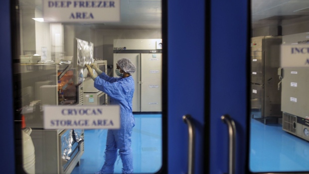 An employee in protective clothing works inside a deep freezer area of the research and development center in Bengaluru, India. 