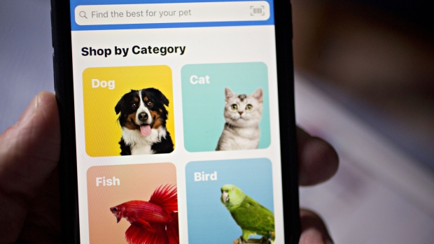 The Chewy.com application is displayed on an Apple Inc. iPhone in an arranged photograph taken in Arlington, Virginia, U.S., on Thursday, June 13, 2019. PetSmart Inc. is taking Chewy public at a proposed valuation of around $7 billion after a contentious ownership battle between PetSmart's creditors and its private equity investors. 