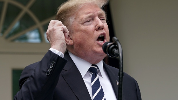 WASHINGTON, DC - MAY 22: U.S. President Donald Trump pretends to make a phone call while speaking about Robert Mueller's investigation into Russian interference in the 2016 presidential election in the Rose Garden at the White House May 22, 2019 in Washington, DC. Trump responded to House Speaker Nancy Pelosi saying he was engaged in a cover up. (Photo by Chip Somodevilla/Getty Images) 
