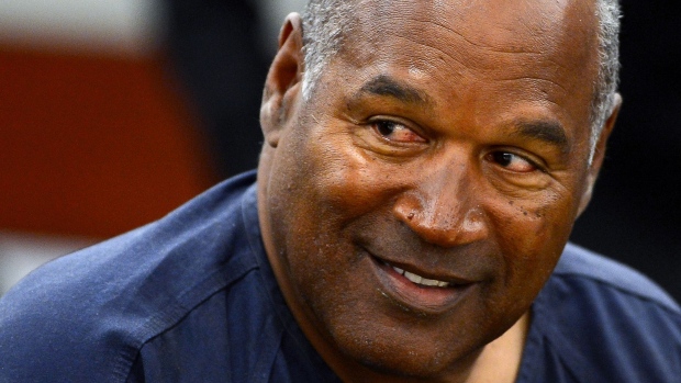LAS VEGAS, NV - MAY 14: O.J. Simpson smiles at an evidentiary hearing in Clark County District Court on May 14, 2013 in Las Vegas, Nevada. Simpson, who is currently serving a nine-to-33-year sentence in state prison as a result of his October 2008 conviction for armed robbery and kidnapping charges, is using a writ of habeas corpus to seek a new trial, claiming he had such bad representation that his conviction should be reversed. (Photo by Ethan Miller/Getty Images)