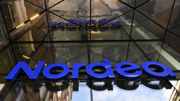 A logo hangs above the entrance to a Nordea Bank Abp office in Stockholm, Sweden, on Tuesday, March 5, 2019. A money-laundering scandal involving Western financial institutions and the former Soviet Union widened with reports that Nordea handled almost $800 million in suspicious funds while a Russian group funneled billions through accounts in Lithuania. 