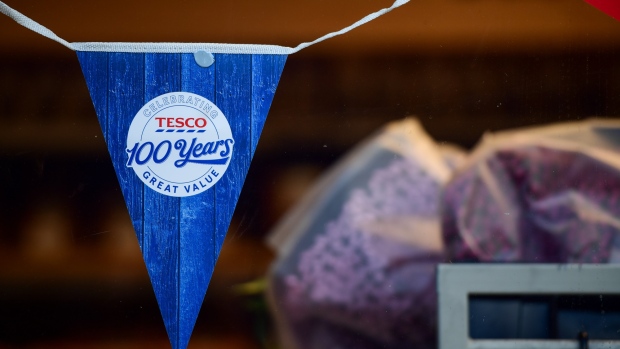 A section of bunting sits in the window of a Tesco Plc supermarket in London, U.K., on Tuesday, Jan. 8, 2019. Investors looking for relief from the tumult of global markets may want to avert their eyes from a report showing that by one measure, U.K. retail sales had their worst year in more than a decade. 
