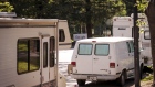 Google LLC signage is seen past recreational vehicles parked on Landings Drive in Mountain View, California, U.S., on Tuesday, May 7, 2019. Mountain View, the epicenter of a Silicon Valley tech boom, is minting millionaires but also fueling a homelessness crisis that the United Nations recently deemed a human rights violation. Thousands of people live in RVs across San Francisco and the broader Bay Area because they can't afford to rent or buy homes. 