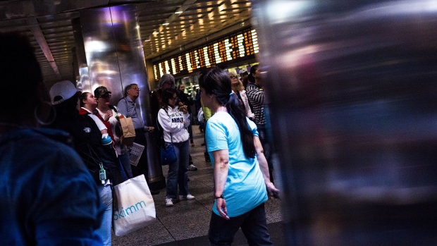 Commuters walk through the Long Island Railroad Co. (LIRR) concourse inside Pennsylvania Station in New York. 