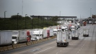 Trucks travel across the World Trade International Bridge in Laredo, Texas, U.S., on Monday, June 10, 2019. Texas, which accounts for more than a third of U.S. trade with Mexico, would be hardest hit by any tariffs on the country. 