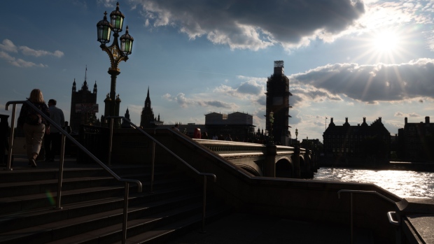 The Palace of Westminster, home to the U.K. Parliament and the House of Lords, left, Westminster Bridge and Portcullis House, right, are viewed from the south bank of the River Thames in London, U.K., on Wednesday, May 22, 2019. U.K. Prime Minister Theresa May’s Brexit legislation isn’t listed for debate in the first week of June as promised, but the government says it still hopes to put it to Parliament that week. 