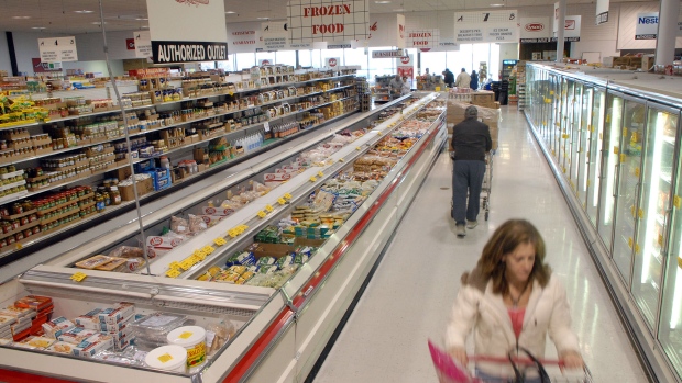 Shoppers walk through the frozen section at Amelia's Grocery Outlet, a "surplus" or "salvage" grocer that buys manufacturers' closeouts, March 27, 2008 in New Holland, Pennsylvania.