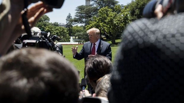 U.S. President Donald Trump speaks to members of the media before boarding Marine One on the South Lawn of the White House in Washington, D.C. on June 11, 2019. 