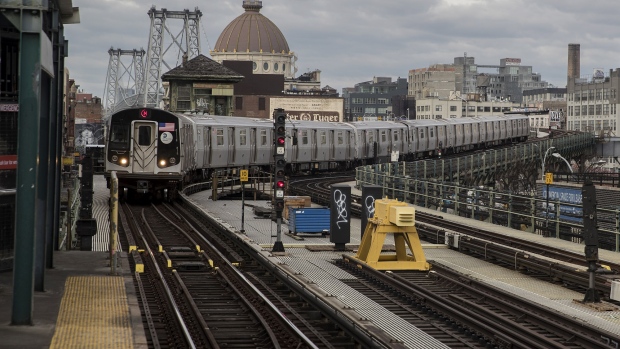 An M subway train arrives at the Marcy Avenue station in the Brooklyn borough of New York. 