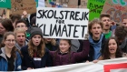 Greta Thunberg holds up a "School Strike for the Climate" sign. Photographer: Sean Gallup/Getty Images
