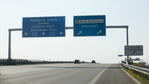 A road traffic sign indicates the direction to the under construction Berlin Brandenburg Internation