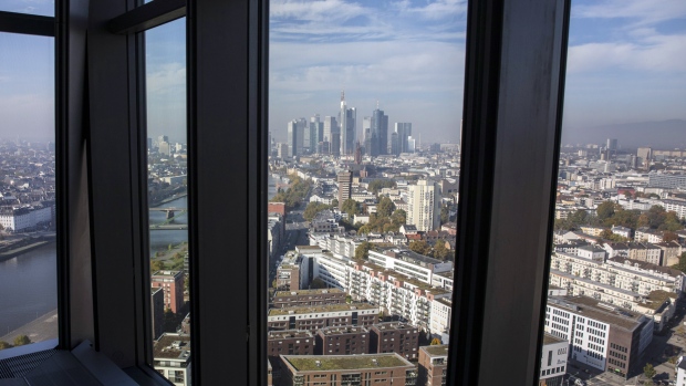 The River Main flows past commercial and residential property as skyscrapers stand in the financial district as the city skyline is seen from the 15th floor pantry area inside the European Central Bank (ECB) headquarters in Frankfurt, Germany, on Wednesday, Oct. 18, 2017. In a tweet with the hashtag #Brexit, Goldman Sachs Group Inc. Chief Executive Officer Lloyd Blankfein on Thursday hailed “great meetings” he had in Frankfurt and said he will spend a lot more time there. 