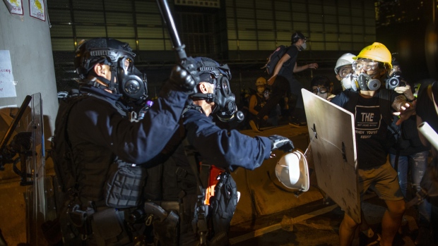 Police clash with protesters in Hong Kong, on July 2. Photographer: Justin Chin/Bloomberg