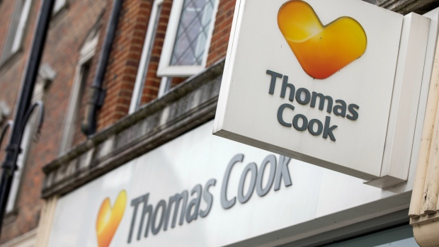 A sign hangs above a Thomas Cook Group Plc travel agency store in East Grinstead, U.K., on Tuesday, April 23, 2019. Thomas Cook rose the most since December after Sky reported potential bidders have approached the debt-laden travel company to purchase all or part of its businesses. 