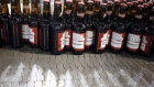 Bottles of beer move along a conveyor belt at the Anheuser-Busch InBev NV Budweiser bottling facility in St. Louis. 