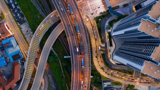 Vehicles travel along a road at dawn in this aerial photograph taken above Johor Bahru, Johor, Malaysia, on Thursday, June 20, 2019. Malaysia's Prime Minister Mahathir Mohamad said he underestimated the challenges of governing the country before his shock election victory last year. “I underestimated because we were on the outside and we didn’t get any information on what was happening on the inside,” Mahathir said. 