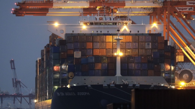 Containers sit stacked on the Jacques Joseph container ship, operated by CMA CGM SA, berthed at a shipping terminal at dusk in Yokohama, Japan, on Thursday, July 11, 2019. Japan and South Korea plan to meet on Friday over Tokyo’s move to restrict vital exports to its neighbor, but neither has much political incentive to climb down from their worst dispute in decades. 