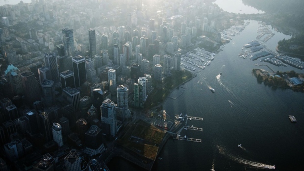 Commercial and residential buildings stand in this aerial photograph taken above Vancouver, British Columbia. 