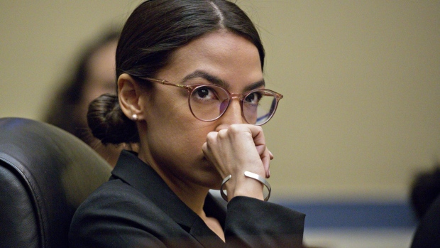 Representative Alexandria Ocasio-Cortez, a Democrat from New York, listens during a House Oversight Committee hearing with Wilbur Ross, U.S. commerce secretary, not pictured, in Washington, D.C., U.S., on Thursday, March 14, 2019. 