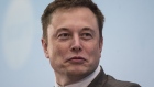 Billionaire Elon Musk, chief executive officer of Tesla Motors Inc., listens during the StartmeupHK Venture Forum in Hong Kong, China, on Tuesday, Jan. 26, 2016. Tesla is looking for a Chinese production partner but is "still trying to figure that out," Musk said. 