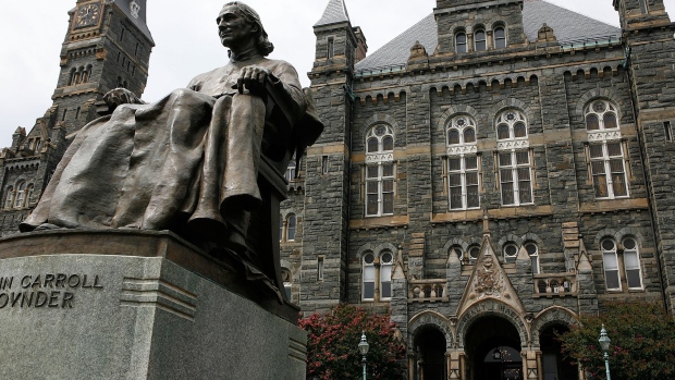 A statue of John Carroll, founder of Georgetown University, sits before Healy Hall on the school's campus August 15, 2006 in Washington, DC.