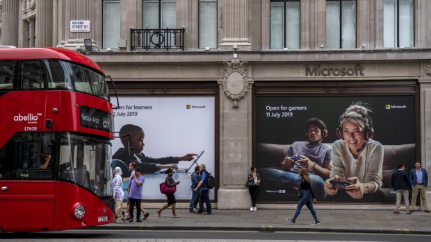 A bus passes the new Microsoft Corp. flagship store in central in London, U.K., on Tuesday, July 9, 2019. Apple Inc.’s flagship central London retail store gets a new neighbor on Thursday, as Microsoft Corp. opens its inaugural European high-street presence just meters away. Photographer: Chris J. Ratcliffe/Bloomberg
