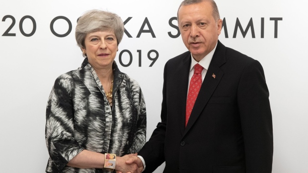 OSAKA, JAPAN - JUNE 29: Britain's Prime Minister, Theresa May, meets Turkey's President, Recep Tayyip Erdogan, during a bilateral meeting the second day of the G20 summit on June 29, 2019 in Osaka, Japan. World leaders have been meeting in Osaka for the annual Group of 20 summit to discuss economic, environmental and geopolitical issues. The US-China trade war has dominated the agenda with U.S President Trump and China's President Xi Jinping scheduled to meet on Saturday for an extended bilateral in an attempt to resolve the ongoing the trade war between the world's two largest economies. (Photo by Carl Court/Getty Images)