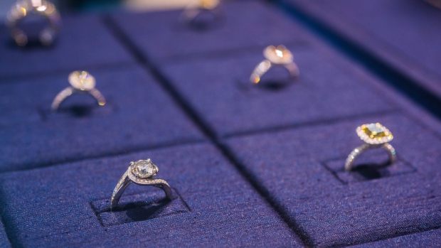 Diamond rings are displayed in a cabinet inside a De Beers SA store in Hong Kong, China, on Thursday, Sept. 14, 2017. Chinese deluxe spending on travel is the "fastest-growing competitor" standing in the way of diamond sales in the world's biggest consumer market, Chief Executive Officer Bruce Cleaver said in an interview. 