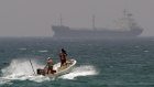 fishermen cross the sea waters off Fujairah, United Arab Emirates, near the Strait of Hormuz. 