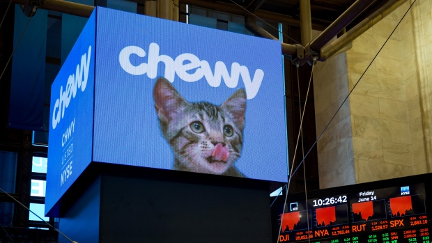 A monitor displays Chewy Inc. signage during the company's initial public offering (IPO) on the floor of the New York Stock Exchange. 