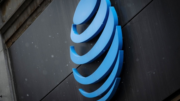 Signage is displayed outside an AT&T Inc. store in Chicago, Illinois, U.S., on Thursday, Jan. 24, 2019. AT&T is scheduled to release earnings figures on January 30. 