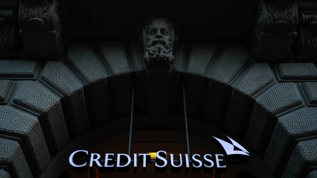 A Credit Suisse logo hangs in the entrance to Credit Suisse Group AG's headquarters in Zurich, Switzerland, on Wednesday, April 24, 2019. Credit Suisse's main trading business swung to a profit after two quarters of losses, as Switzerland's second-largest lender emerged relatively unscathed from what rival UBS Group AG called one of the worst environments in recent history. 