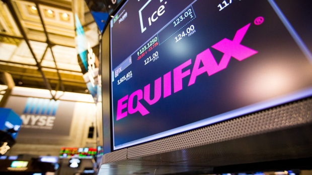 A monitor displays Equifax Inc. signage on the floor of the New York Stock Exchange (NYSE) in New York, U.S., on Friday, Sept. 8, 2017. The dollar fell to the weakest in more than two years, while stocks were mixed as natural disasters damped expectations for another U.S. rate increase this year. 
