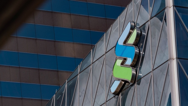 The Standard Chartered Plc logo is displayed atop the Standard Chartered Wealth Management Centre in Hong Kong, China, on Saturday, Feb 16, 2019. Standard Chartered is scheduled to release full year earnings results on Feb. 26. 