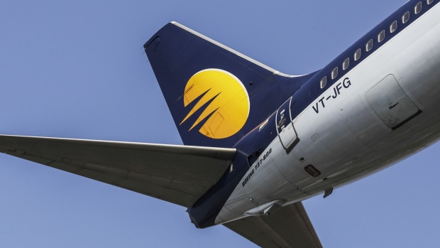 The livery of an aircraft operated by Jet Airways India Ltd. is seen on the tail fin as the plane prepares to land at Chhatrapati Shivaji International Airport in Mumbai, India, on Monday, Nov. 7, 2016. Jet Airways, part-owned by Etihad Airways PJSC, is scheduled to announce second-quarter earnings figures on Nov. 11. 