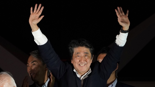 Shinzo Abe, Japan's prime minister and president of the Liberal Democratic Party (LDP), waves during a campaign event in Tokyo, Japan, on Saturday, July 20, 2019. As Japan prepares for an upper house election, Abe appears to have taken a page from social media giants like U.S. President Donald Trump and stepped up his influencer game. 