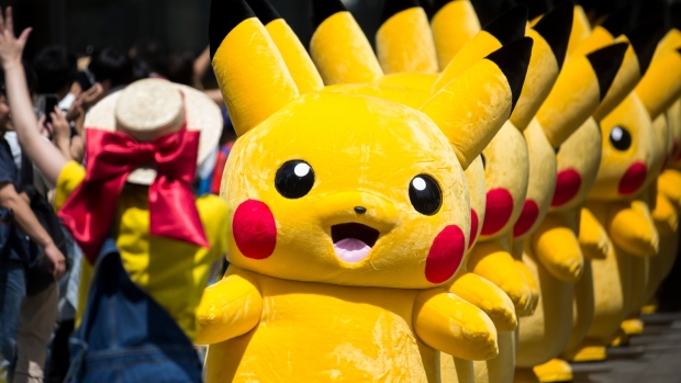 YOKOHAMA, JAPAN - AUGUST 09: Performers dressed as Pikachu, a character from Pokemon series game titles, march during the Pikachu Outbreak event hosted by The Pokemon Co. on August 9, 2017 in Yokohama, Kanagawa, Japan. A total of 1, 500 Pikachus appear at the city's landmarks in the Minato Mirai area aiming to attract visitors and tourists to the city. The event will be held through until August 15. (Photo by Tomohiro Ohsumi/Getty Images)